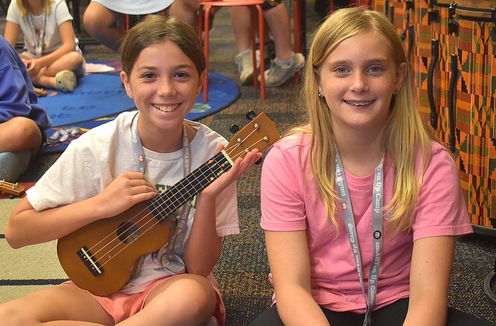 Isabella Cz, a rising sixth grader at Dr. Mona Jain Middle School, and Skylar Flandreau, a rising sixth grader at Martha B. King Middle School, take turns playing the ukulele during the Manatee Arts Education Council smARTen Up Camp.