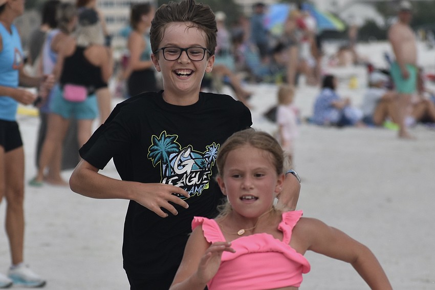 Mason Boyle, 10, and Kaia Vihrachoff, 9, race for the finish line.