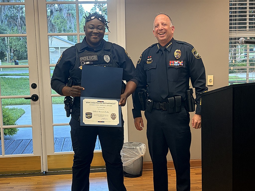 Oakland Chief of Police Darron Esan presented School Resource Officer Samaria Lake with two awards during the town’s commission meeting Tuesday, May 26.