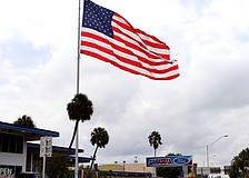 A giant American flag has flown above Sarasota Ford since the 1970s.