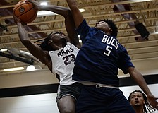 Carter Evans (left), a rising senior forward with Riverview boys basketball, drives toward the rim. The Hoop Vibe Summer League is an opportunity for him to workshop his skills in a real-game setting.