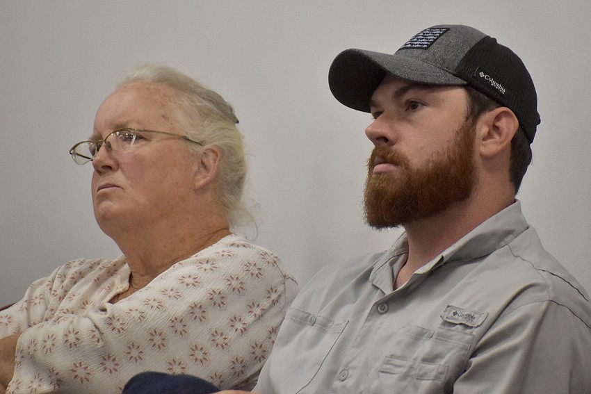 Myakka City's Elizabeth Efferson and Duette's John Dunn listen to the hearing after driving across the county to attend the June 4 commission meeting regarding the comprehensive plan updates.