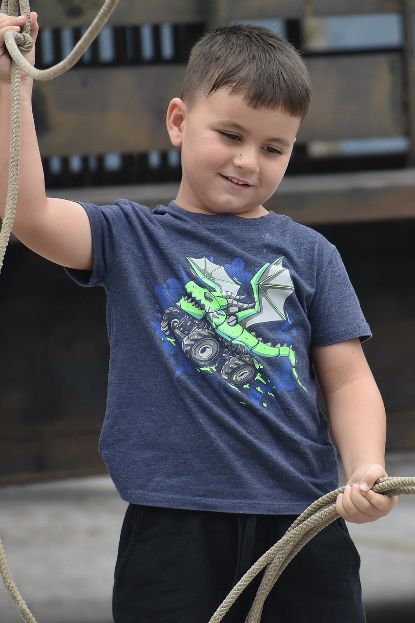 Peter Calnan, 6, tries the lasso.