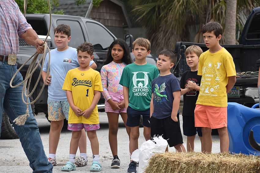 Parker Mast, 9, Clark Mast, 6, Antonella Rojas, 9, Daniel Bitter, 7, Leo Barnes 5, Peter Calnan, 6, Brody Jenkins, 10, prepare to try the lasso.