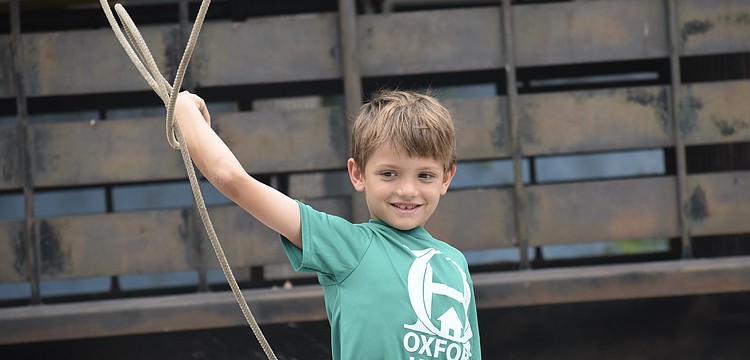 Daniel Bitter, 7, tosses the lasso.