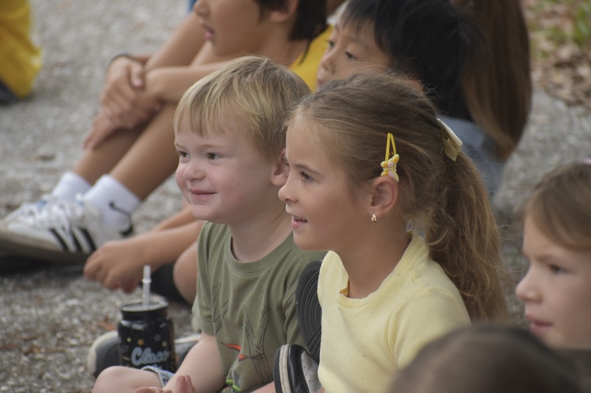 Zeven Johnston, 4, and Uliana Aponchuk, 6, watch as the demonstration begins.