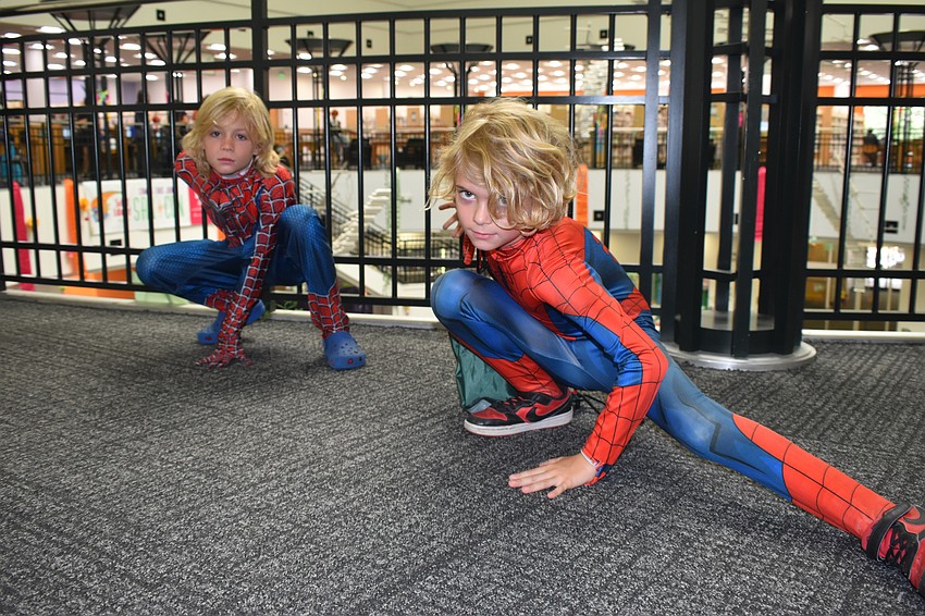 Noah Winter, 9, and Jack Taylor, 8, strike a Spider-Man pose.