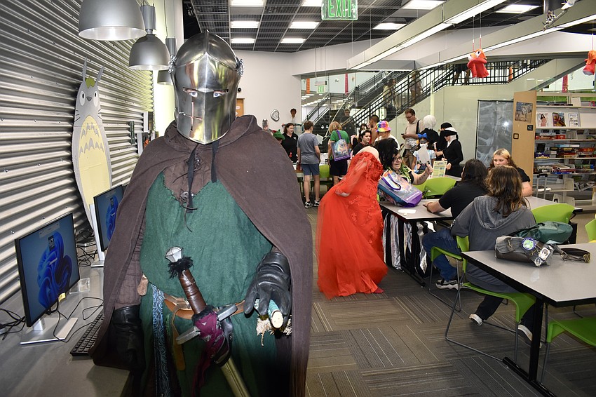 Owen Quinlin suits up in armor at the event.