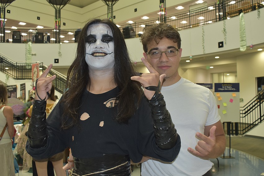 Rodolfo Murillo and Jackson Velazquez dressed as The Crow and Hank Hill.
