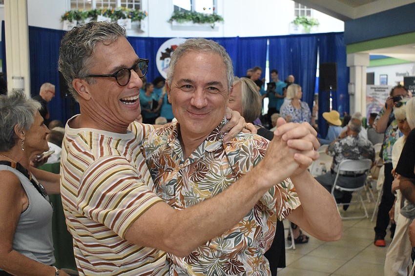 James Warren and Gus Butera go for a dance as, after being among the couples recognized for 25 years together.