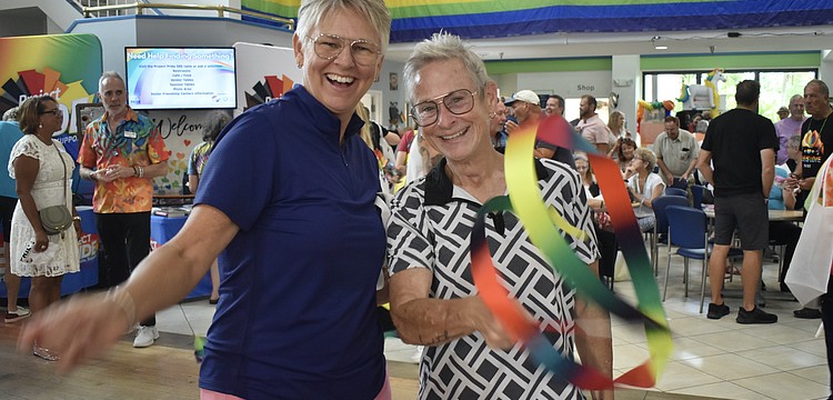 Amy Snider and Julie Waters bring some ribbon energy to the dance floor.