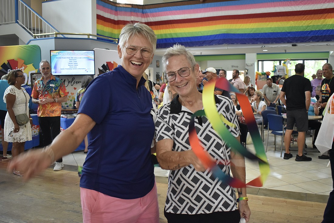 Amy Snider and Julie Waters bring some ribbon energy to the dance floor.