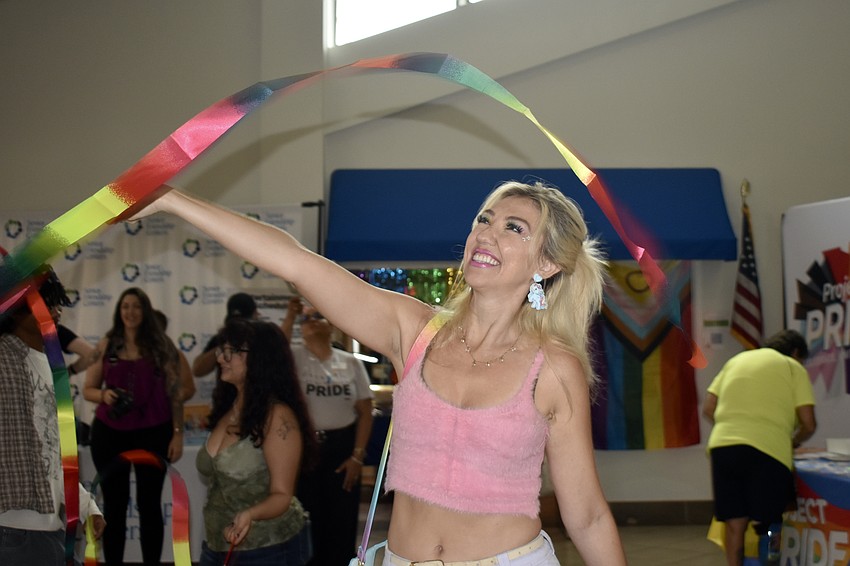 Cassandra Payne waves a ribbon during a song.
