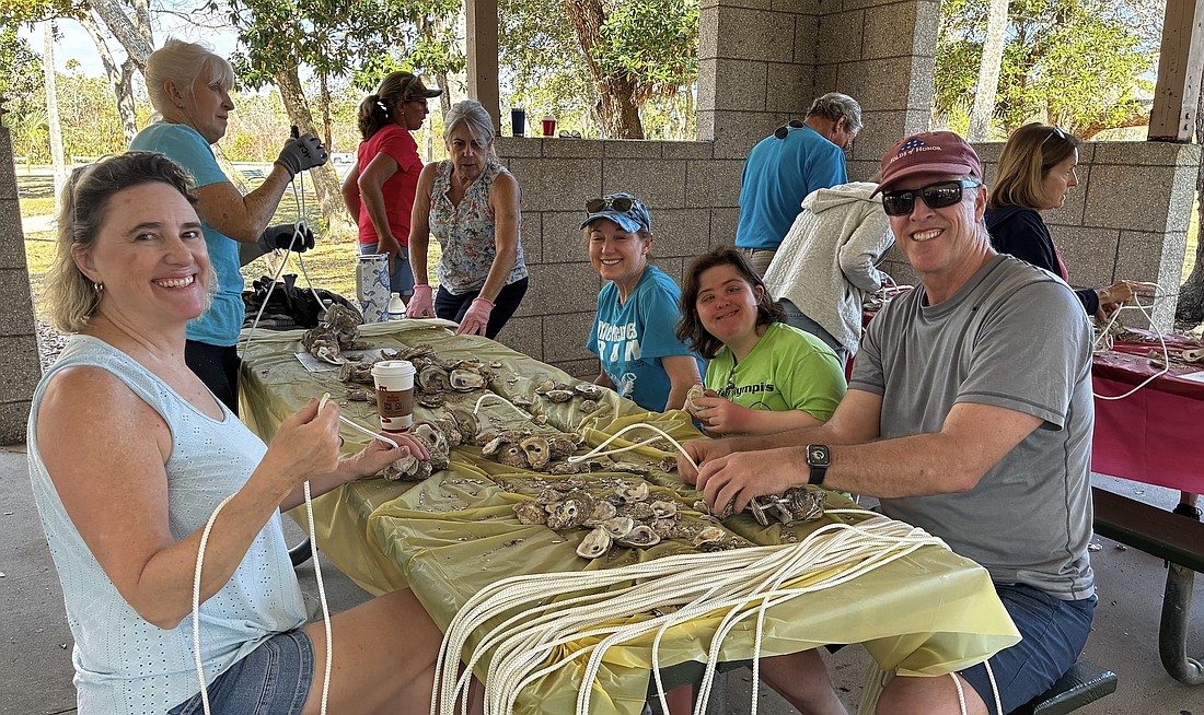 Morgan Hanrahan (left) and Peggy and John Lessig and Rachel at a vertical oyster garden assembly March 7 at Herschel King Park in Palm Coast in conjunction with the Flagler Beach Yacht Club. Courtesy photo