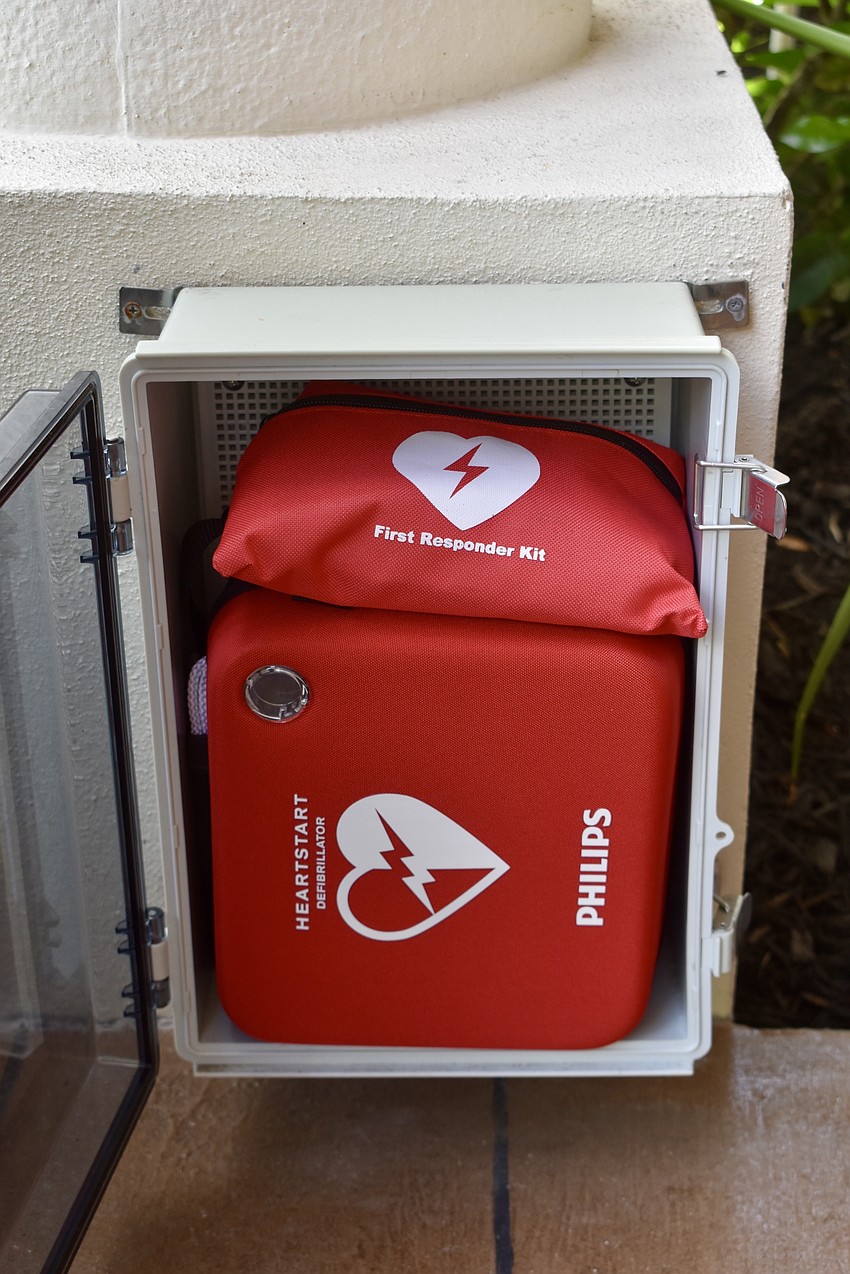 A waterproof box outside of Jim Emanuelson's front door holds a first aid kit and an AED for the neighborhood's use.