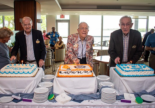 Plymouth Harbor residents Dr. Frederick "Fred" Moffat, George "Gus" Nimick and James "Jim" Griffith each cut into their cakes in a unique triple 99th birthday celebration.