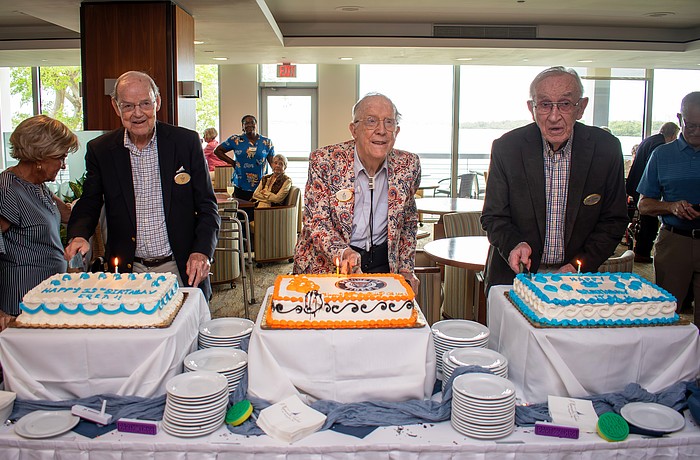 Plymouth Harbor residents Dr. Frederick "Fred" Moffat, George "Gus" Nimick and James "Jim" Griffith each cut into their cakes in a unique triple 99th birthday celebration.