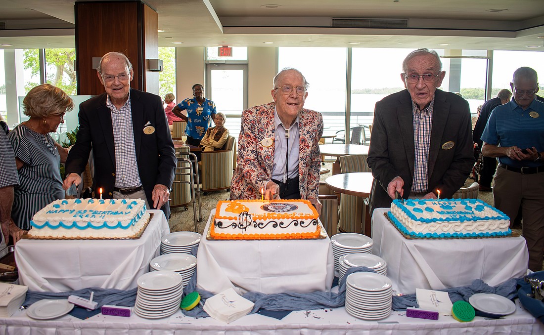 Plymouth Harbor residents Dr. Frederick "Fred" Moffat, George "Gus" Nimick and James "Jim" Griffith each cut into their cakes in a unique triple 99th birthday celebration.