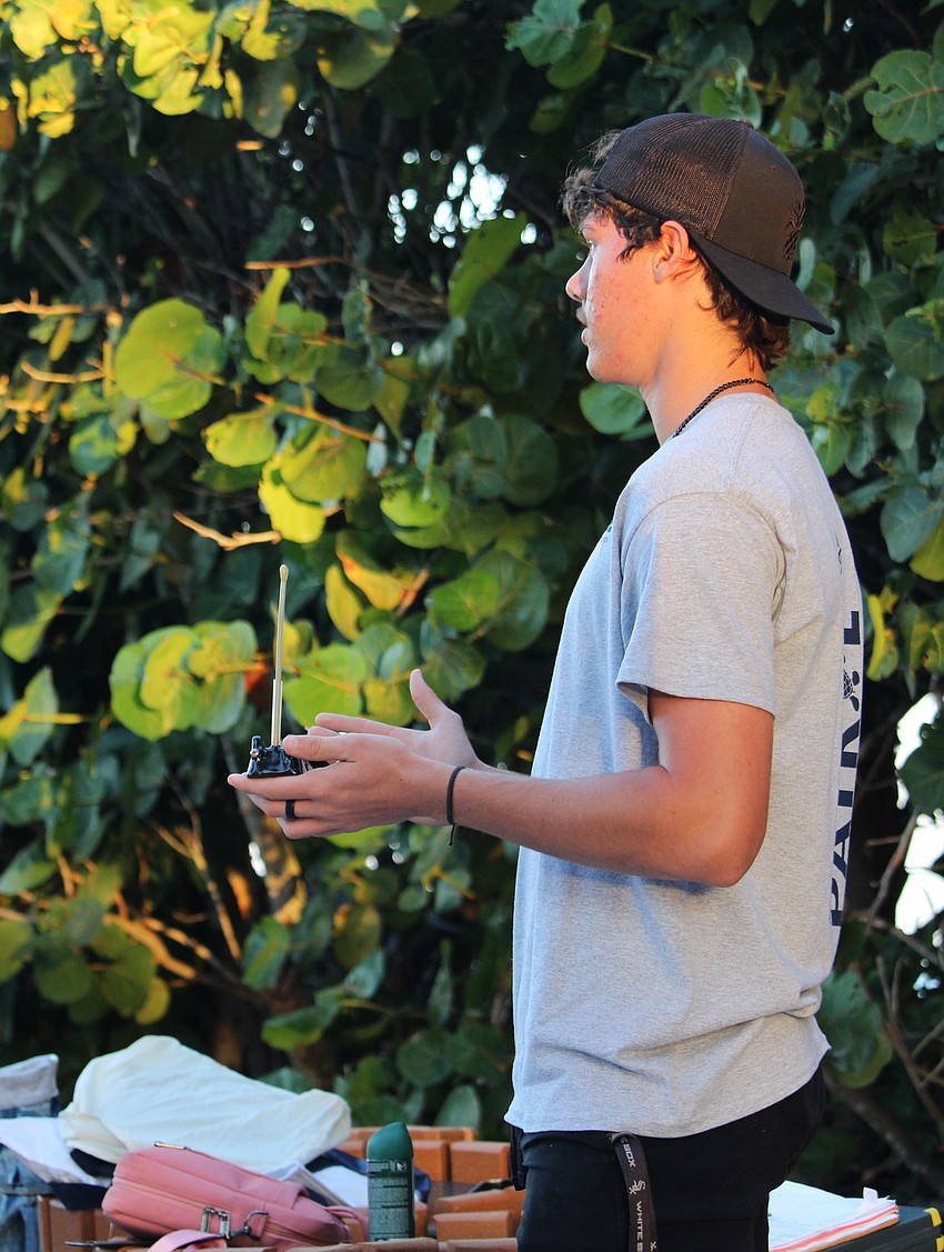 Volunteer Ben Jameson showcases the different types of tracking devices researchers may use to monitor sea turtle activity off Longboat Key.