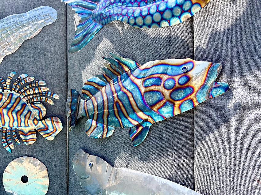 Metal artist John Grammer said he has been working to develop ever more precise techniques with flames to capture intricate patterns like that of groupers and lion fish.