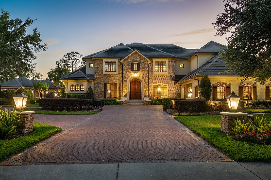 The home at 9121 Tibet Pointe Circle, Windermere, sold June 5, for $13,200,000. This estate showcases a resort-style pool complete with slide, waterfall, diving rock, swim-up seating and a fireside lounge. The sellers were represented by Jay Martin, Corcoran Premier Realty.