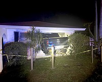 All four wheels of the Ford F-150 penetrated the inside of the Palm Aire home.