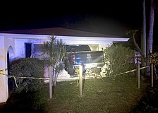 All four wheels of the Ford F-150 penetrated the inside of the Palm Aire home.