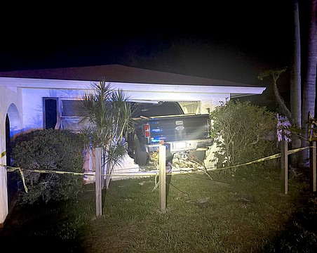 All four wheels of the Ford F-150 penetrated the inside of the Palm Aire home.