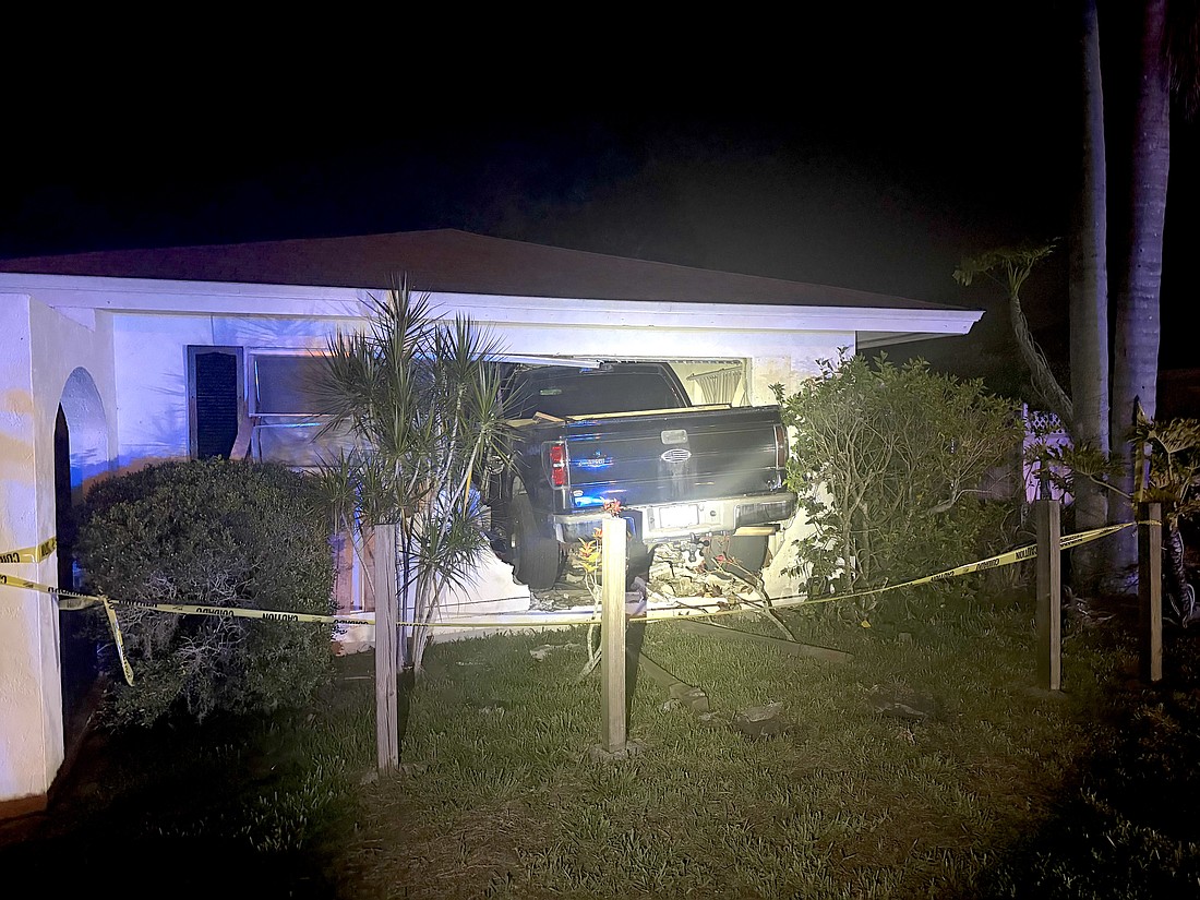 All four wheels of the Ford F-150 penetrated the inside of the Palm Aire home.
