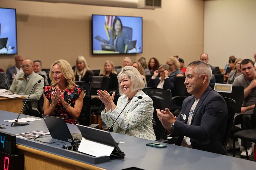 Nancy Lohman (center) claps alongside Science Coordinator Jen Taylor (left) and MOAS Curator of Science Seth Mayo (right). Photo courtesy of Volusia County Schools
