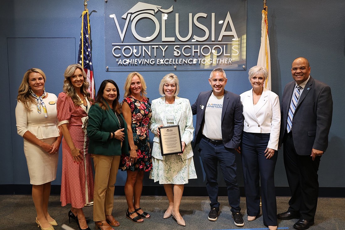 Nancy Lohman (center) is recognized by the Volusia County School Board. From left to right: School Board members Krista Goodrich, Jessie Thompson, Superintendent Carmen Balgobin, Science Coordinator Jen Taylor, Nancy Lohman, MOAS Curator of Science Seth Mayo, and School Board members Donna Brosemer and Chair Ruben Colon. Photo courtesy of Volusia County Schools