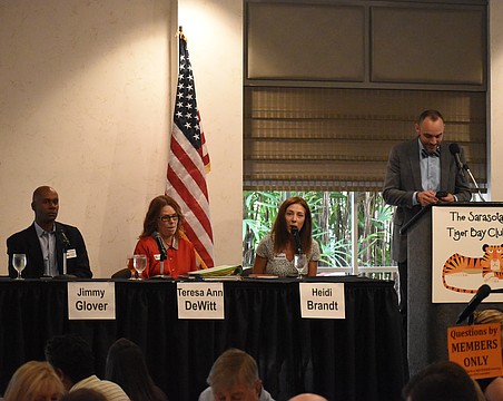 Jimmy Glover, Teresa DeWitt, Heidi Brandt speak at the forum, beside moderator Kevin Cooper.