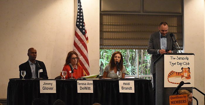 Jimmy Glover, Teresa DeWitt, Heidi Brandt speak at the forum, beside moderator Kevin Cooper.