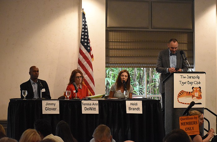 Jimmy Glover, Teresa DeWitt, Heidi Brandt speak at the forum, beside moderator Kevin Cooper.