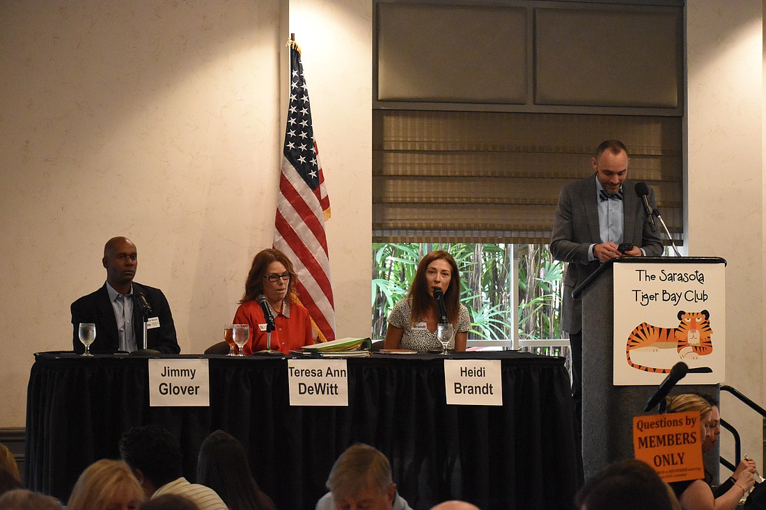 Jimmy Glover, Teresa DeWitt, Heidi Brandt speak at the forum, beside moderator Kevin Cooper.