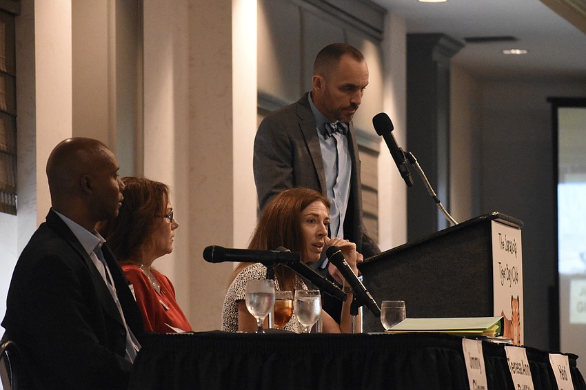 Jimmy Glover, Teresa DeWitt, Heidi Brandt speak at the forum, beside moderator Kevin Cooper.