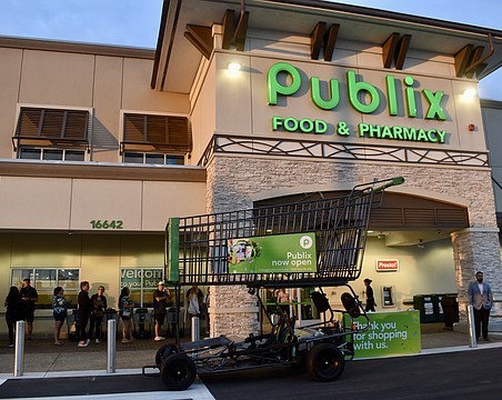 East County residents wait in line before 7 a.m. on June 11 to start shopping at the new Publix at 16642 State Road 64 East.
