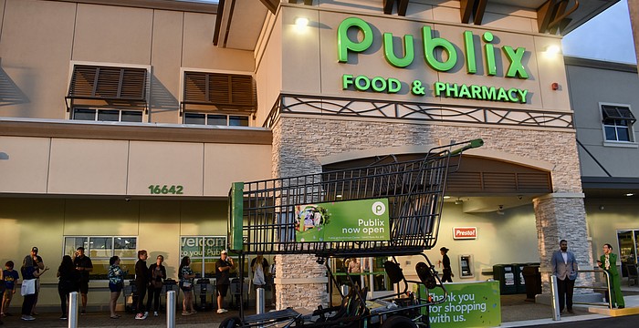 East County residents wait in line before 7 a.m. on June 11 to start shopping at the new Publix at 16642 State Road 64 East.
