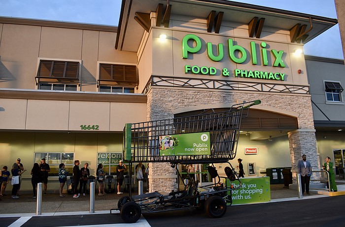 East County residents wait in line before 7 a.m. on June 11 to start shopping at the new Publix at 16642 State Road 64 East.