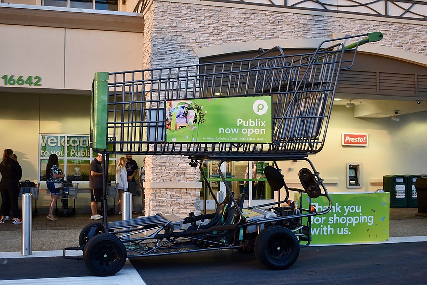 The oversized Publix cart will cruise around the area after the grand opening to let residents know there's a new Publix in East County.