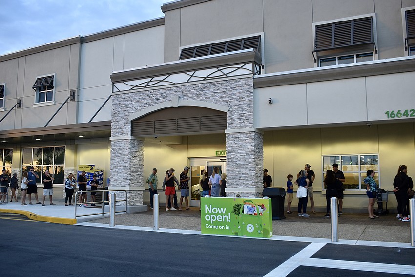 Over 50 people line up before 7 a.m. on June 11 to be among the first shoppers at the new Publix at Northchase Center.