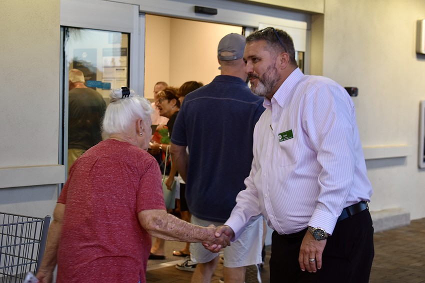 Saddlehorn Estates' Valerie Moore is greeted by Store Manager Josh Jordan.