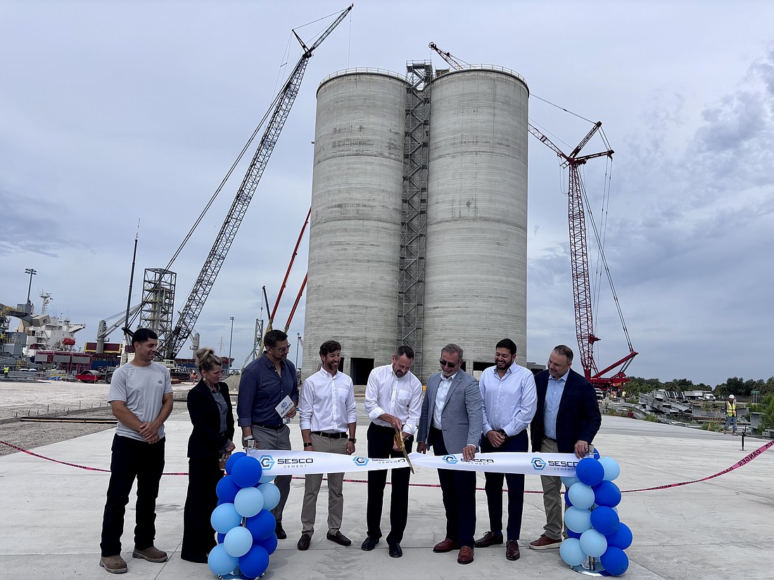 Leaders from Port Tampa Bay and Sesco Cement cut the ribbon to officially open the company's new cement import terminal at Port Redwing.