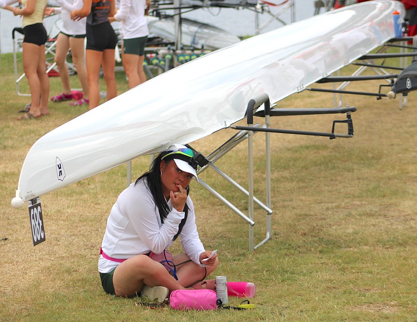 Competing at the USRowing Youth National Championships can be nerve wracking so Kat Wu, the coxswain for the Green Lake Crew of Seattle takes a few moments Thursday to be one with her team's boat.