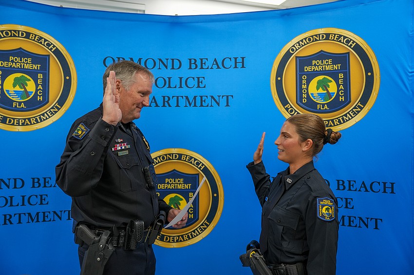 Ormond Beach Police Chief Jesse Godfrey swears in Officer Reilley McRay. Photo courtesy of Pauline Dulang/OBPD Ormond Beach Police Chief Jesse Godfrey swears in Officer Reilley McRay. Photo courtesy of Pauline Dulang/OBPD