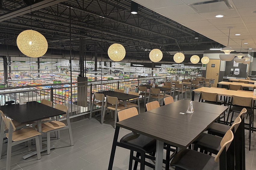 An upstairs dining area overlooks the store.