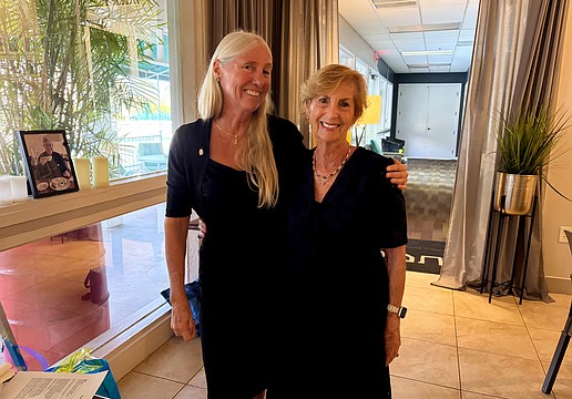 Former Rotary Club of Longboat Key President Jan Wallace congratulates current President Terri Driver, who made club history in accepting the role two years in a row at the June 11 cerermony.