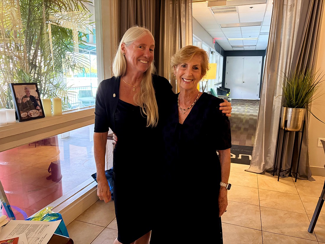 Former Rotary Club of Longboat Key President Jan Wallace congratulates current President Terri Driver, who made club history in accepting the role two years in a row at the June 11 cerermony.