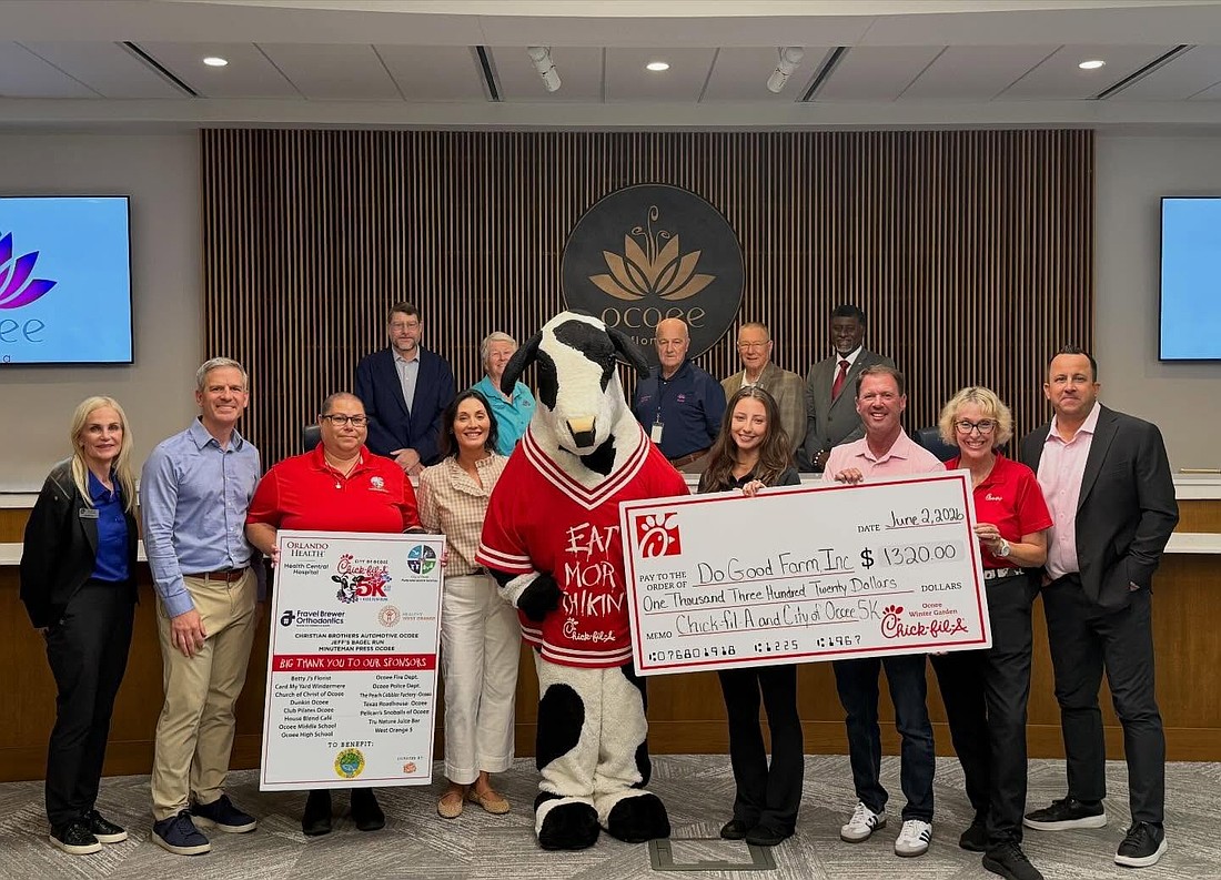 Employees of Chick-fil-A Ocoee presented the Do Good Farm nonprofit with a check.