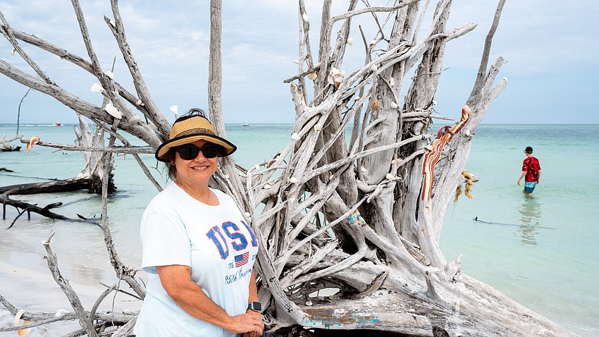 Lynnle Olevnik, who grew up on the Gulf Coast, returned to Beer Can Island with high school friends this June. Olevnik said she appreciated the driftwood painting that resembled petrified wood but wasn’t a fan of the brightly colored paintings. Lynnle Olevnik, who grew up on the Gulf Coast, returned to Beer Can Island with high school friends this June. Olevnik said she appreciated the driftwood painting that resembled petrified wood but wasn’t a fan of the brightly colored paintings.